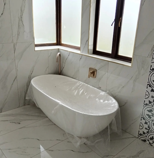Freestanding bath install in marble bathroom — Amanzimtoti